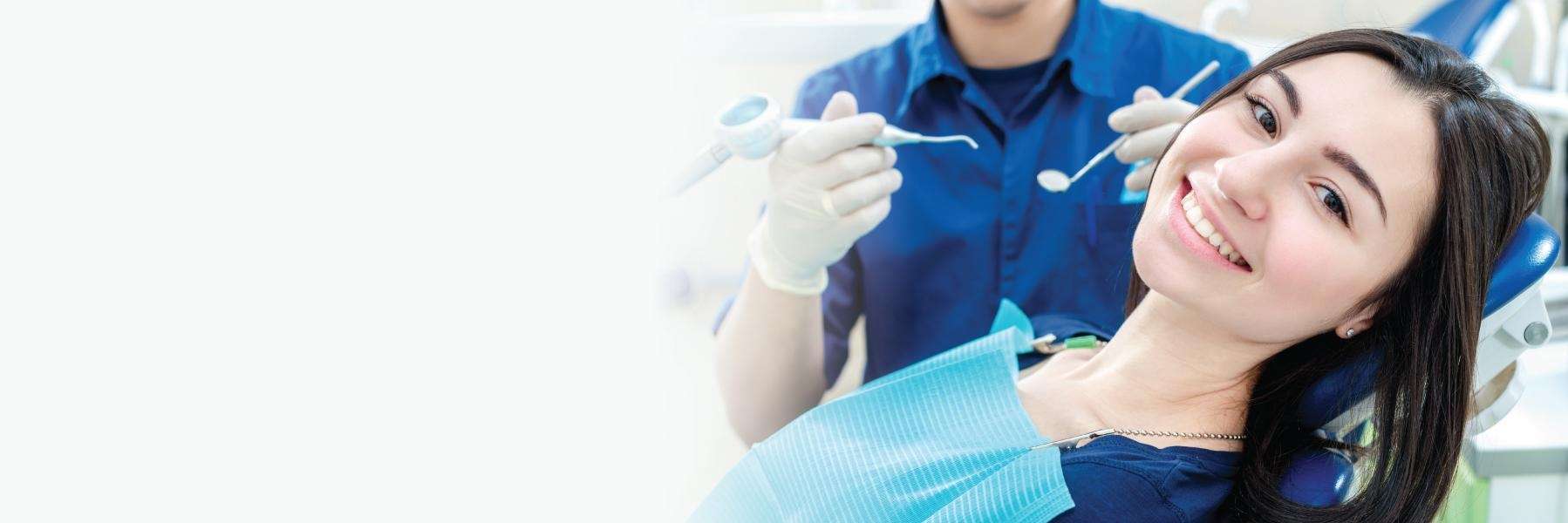 Woman getting a dental exam | Dentist in Chesterfield MO