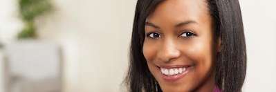 Smiling woman | dental implant treatment Chesterfield