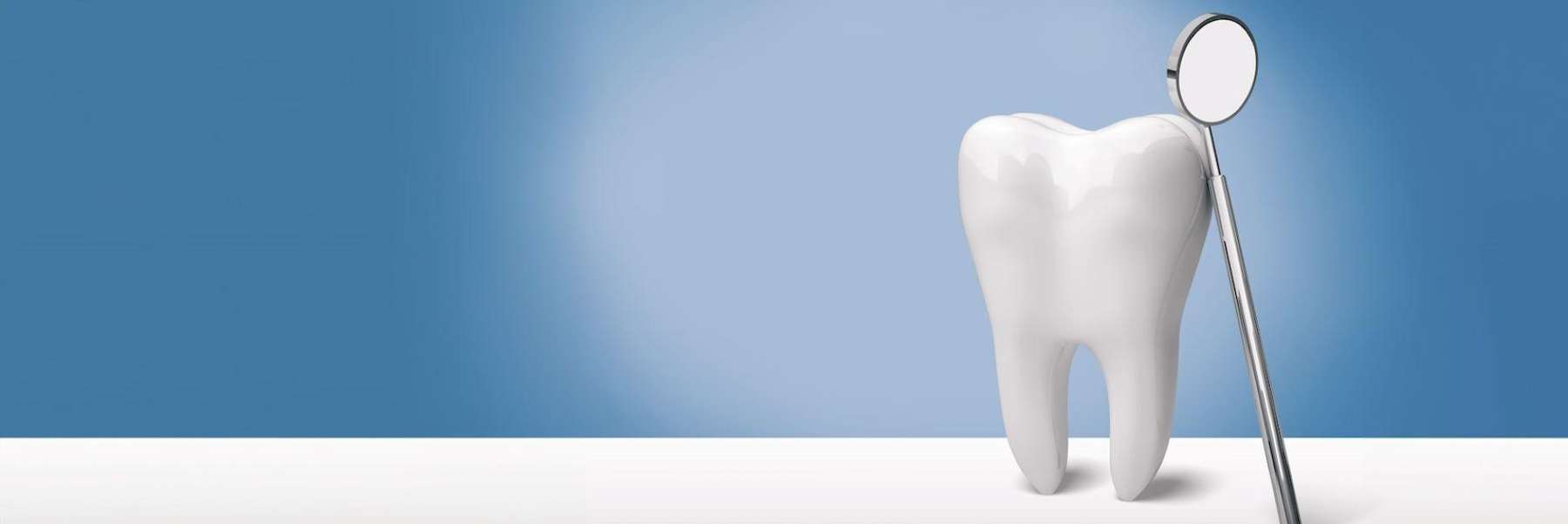 An illustration of a tooth and a dental mirror