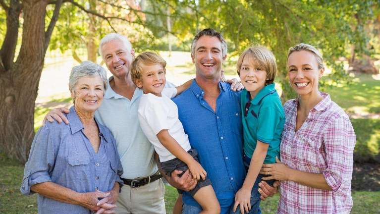 A smiling family at the park | Chesterfield dentist