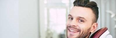 man smiling in dental chair