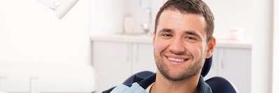 A man sitting in the dentist's office